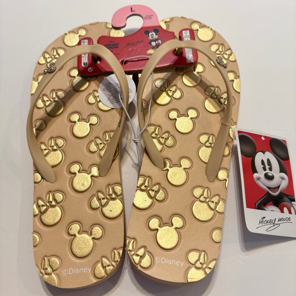 NWT. Primark Disney flip-flops size Large (9/10) feature gold-colored mickeys